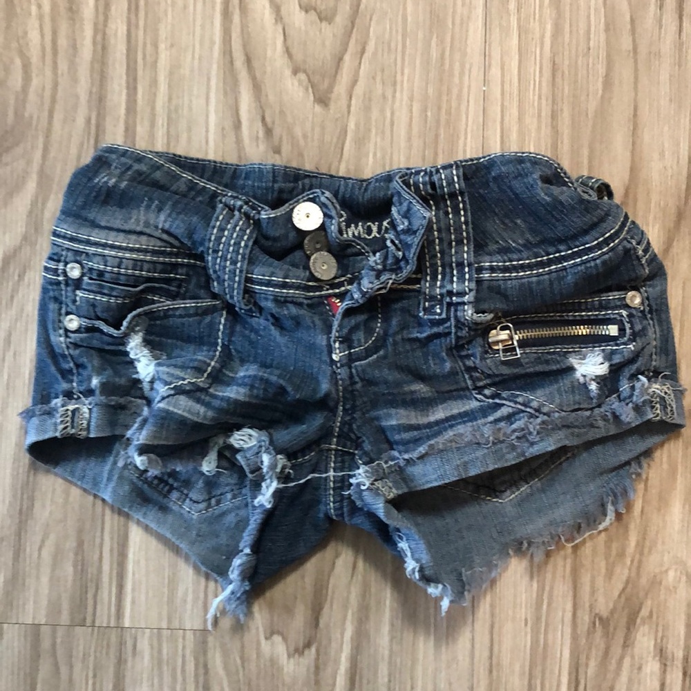 Good condition, dark denim short shorts. Size 0.